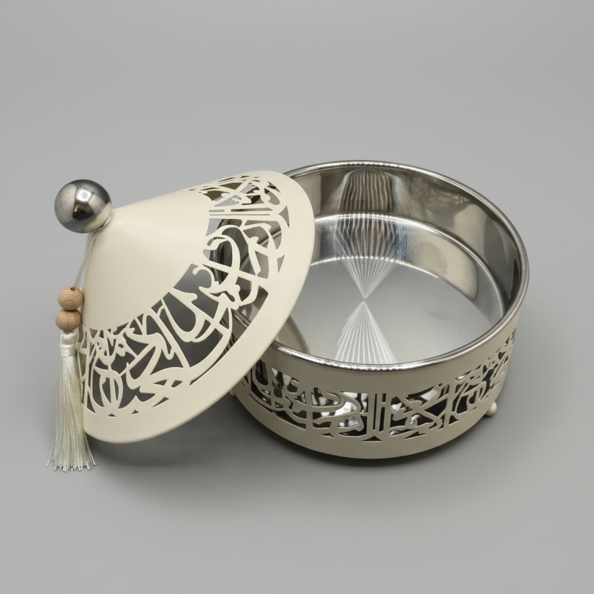 Decorative wall light fixture with intricate design on a gray wall.