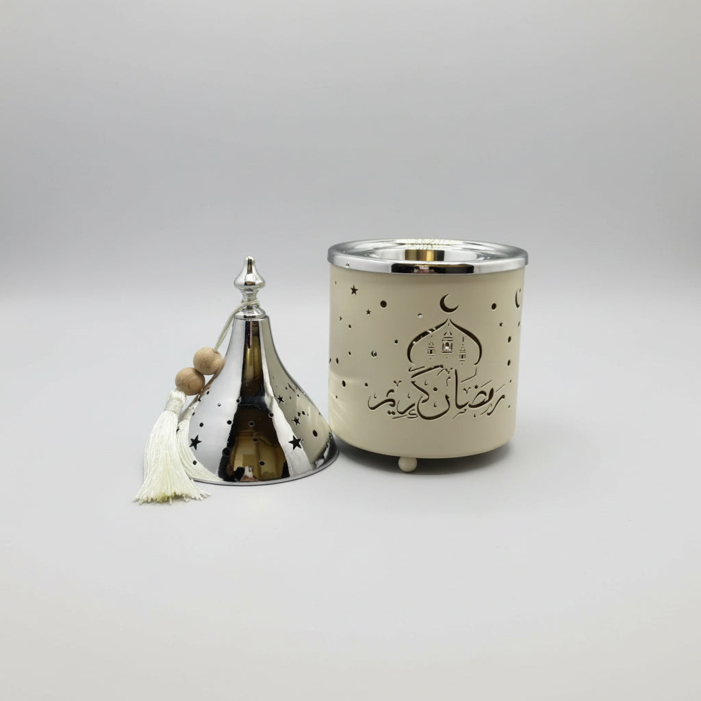 Decorative candle with star pattern on a plain background