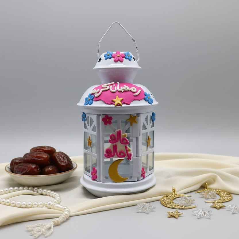 Decorative lantern with floral design on a gray wall