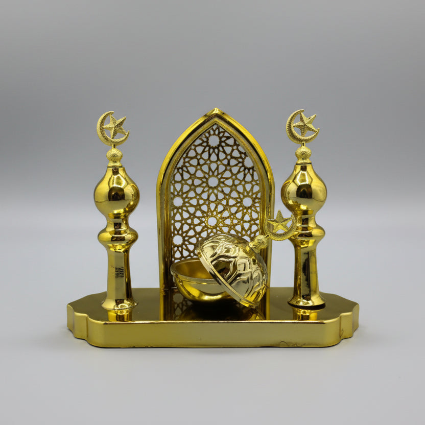 Gold decorative wall piece on a gray background