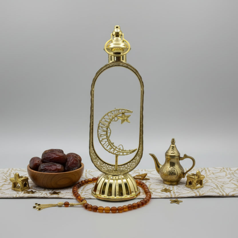 Decorative gold wall mount with star and moon design on a gray background