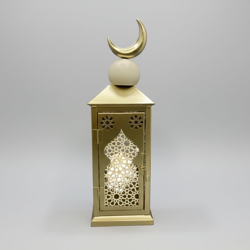 Decorative wall art with geometric patterns and a crescent moon on a gray wall.