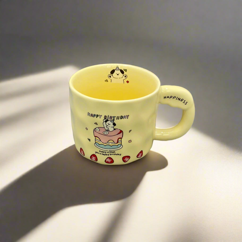 Yellow mug with cartoon character on a gray background