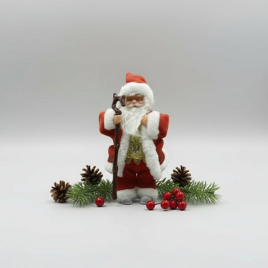 Santa Claus figurine holding a rifle on a white background