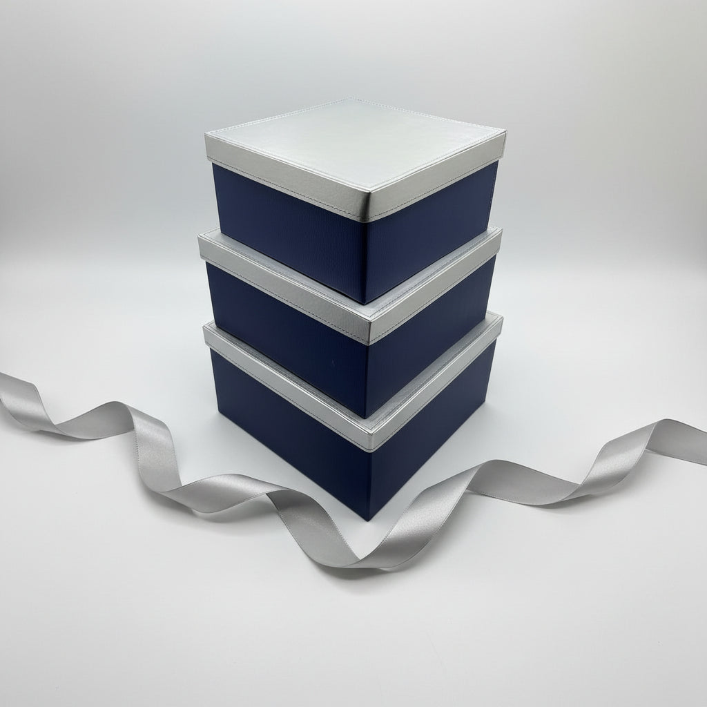 Three triangular shelves with blue backs and white frames on a gray surface.