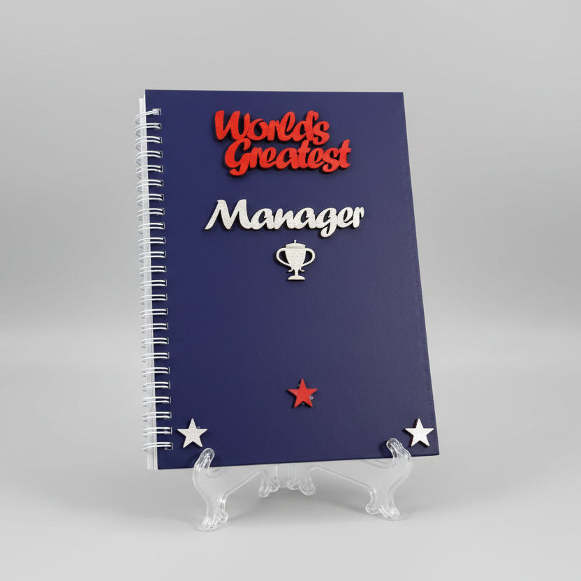 Notebook with decorative text and stars on a white surface