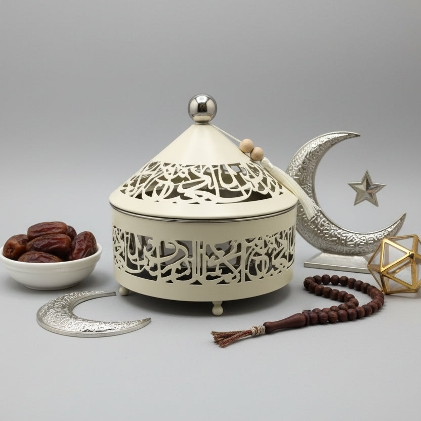 Decorative wall-mounted lantern with intricate cut-out design on a plain wall.