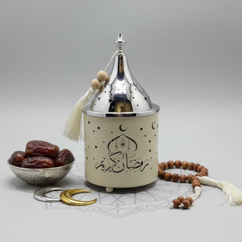 Decorative lantern with Arabic text, dates, and a rosary on a light gray background