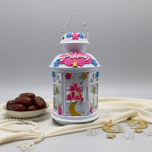 Decorative lantern with floral design on a gray wall