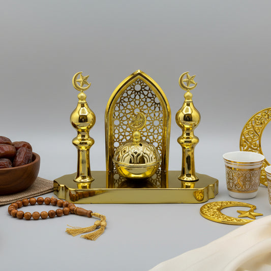 Gold decorative item on a gray surface