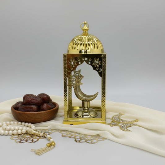 Gold decorative item on a gray background