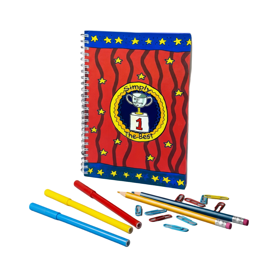 Notebook with decorative cover and stationery items on a gray background