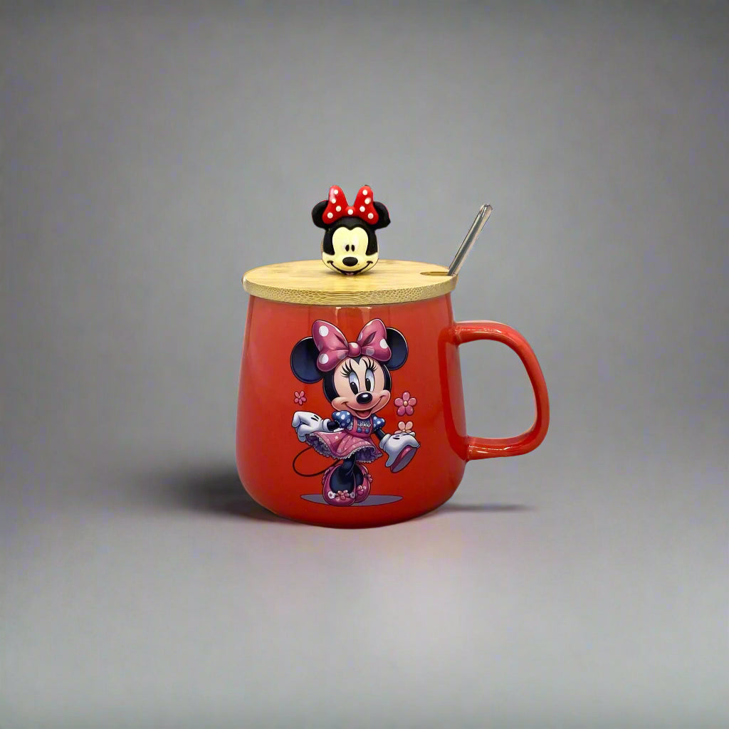 Red teapot-shaped object with cartoon characters on a gray wall.