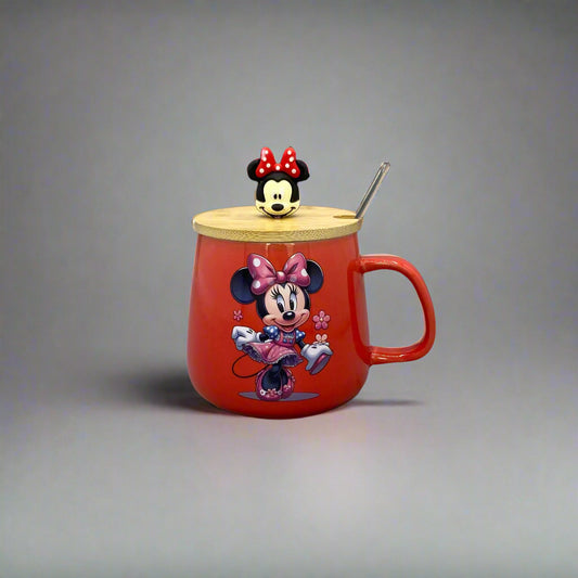 Red teapot-shaped object with cartoon characters on a gray wall.