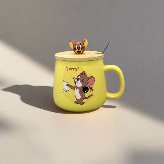 Yellow mug with cartoon character on a gray surface